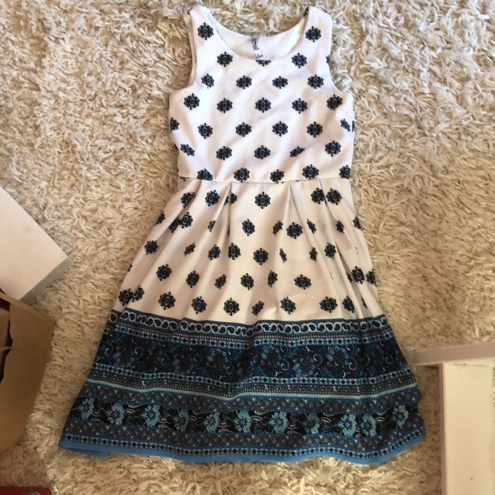 White and blue floral design dress.